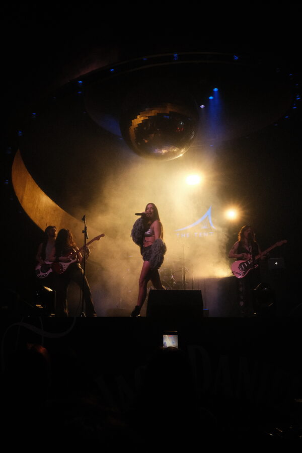 Full stage under the mirror ball, lights and haze